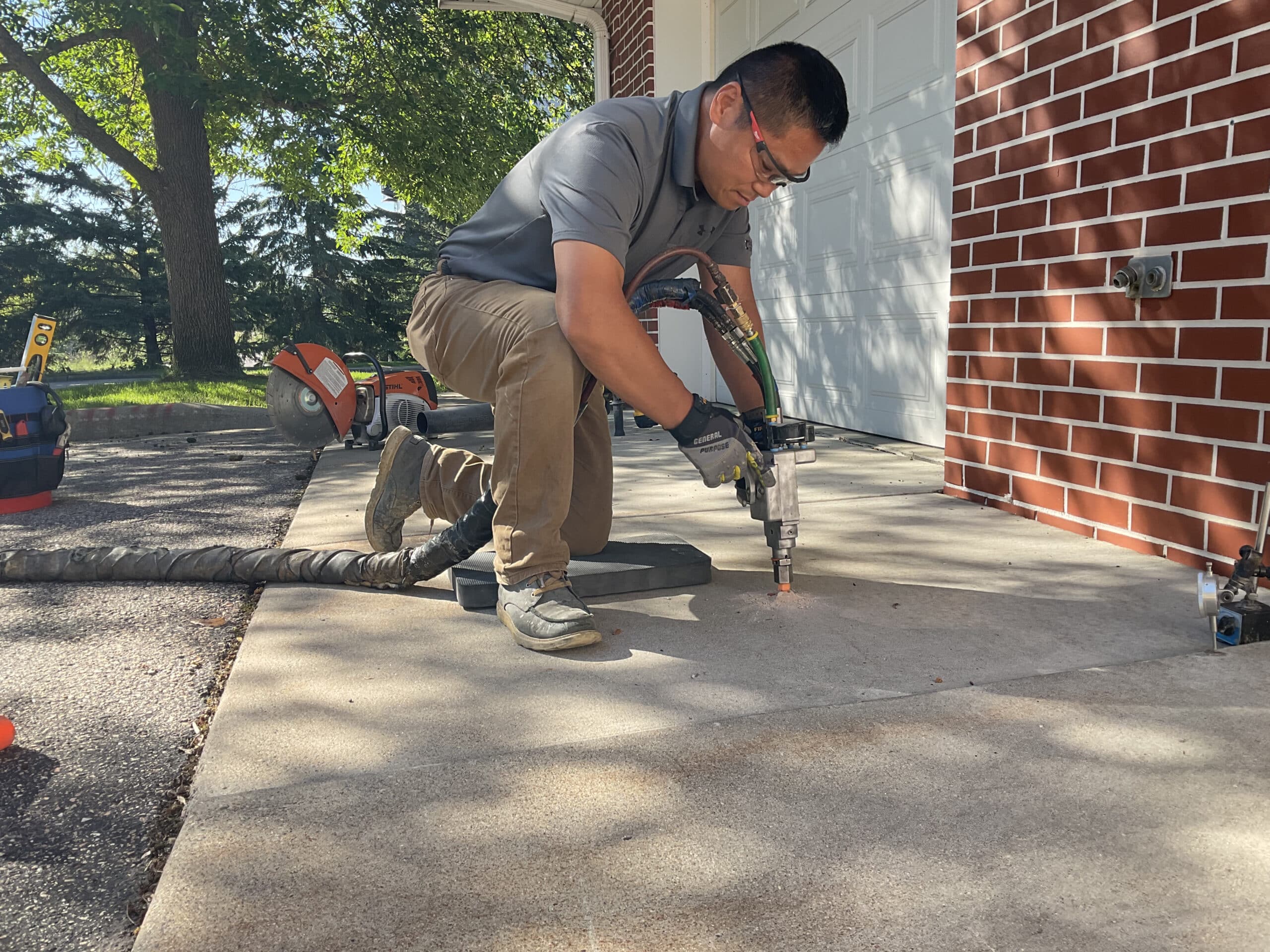 Concrete leveling services by Inline Concrete correcting driveway concrete in MN